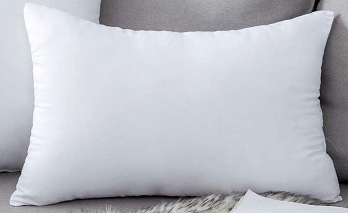 White pillow on a gray sofa