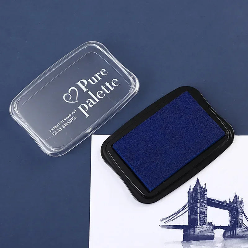 Blue ink pad with 'Pure Palette' container on a dark blue background
