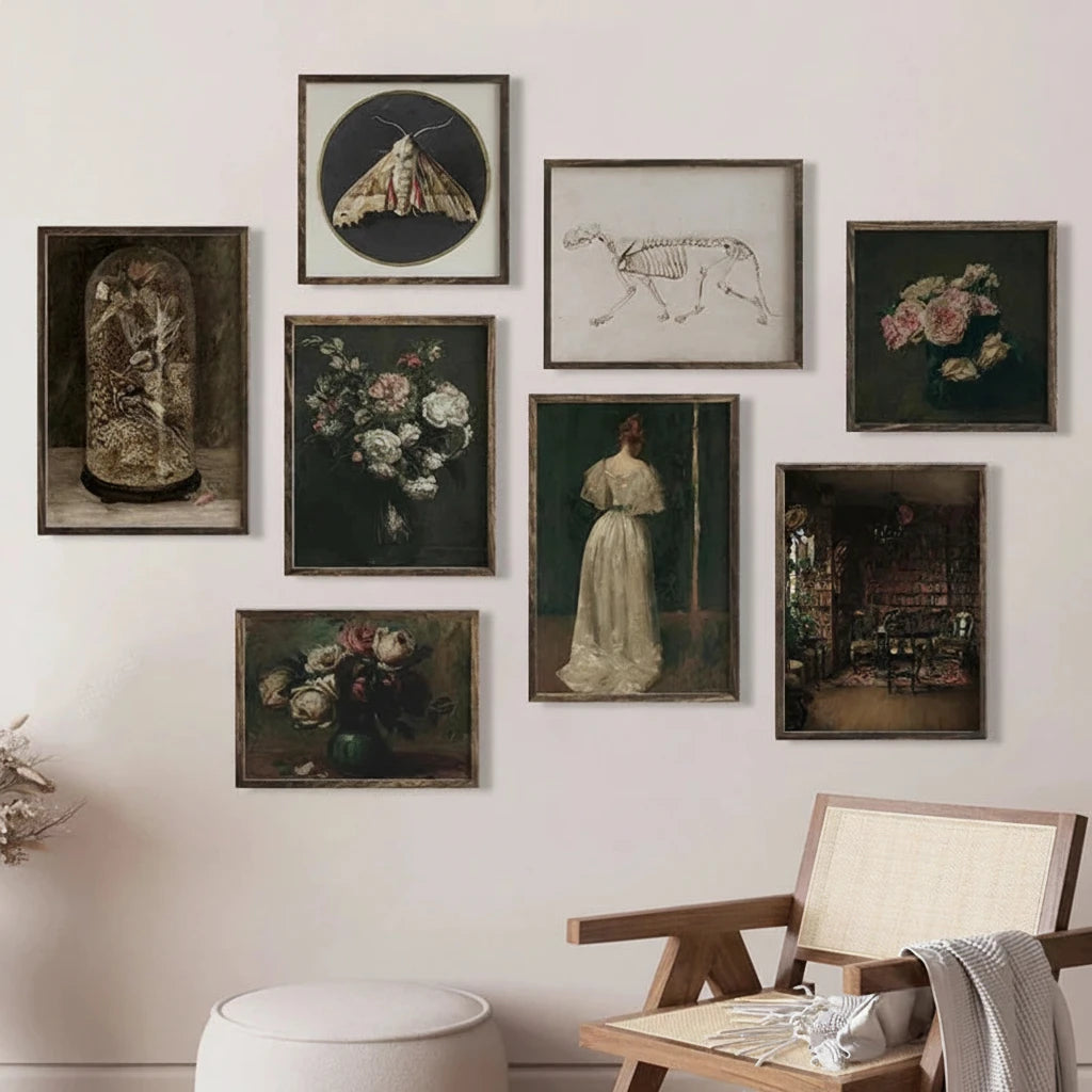 Wall with various framed artworks and a wooden chair with a white cushion.
