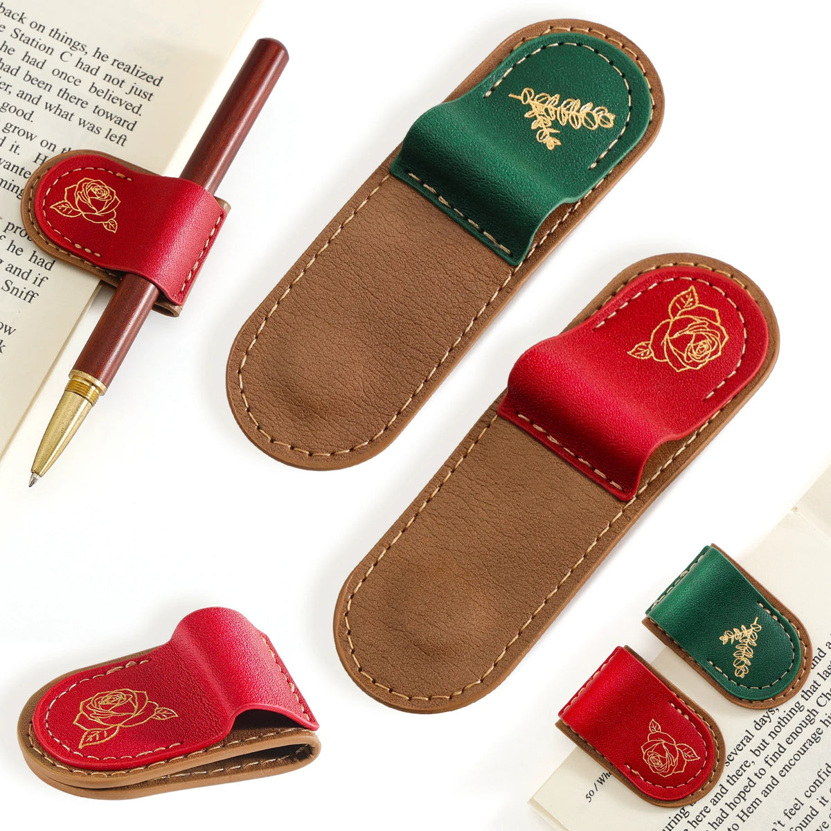 A set of leather pen loops and pen holders shown on a white background with pages of text as props. The products include red and green leather loops with gold-embossed rose and floral designs, and one brown leather loop.