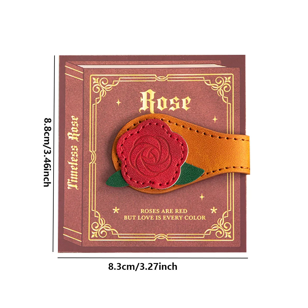 Decorative notebook with a rose design and measurements on a white background