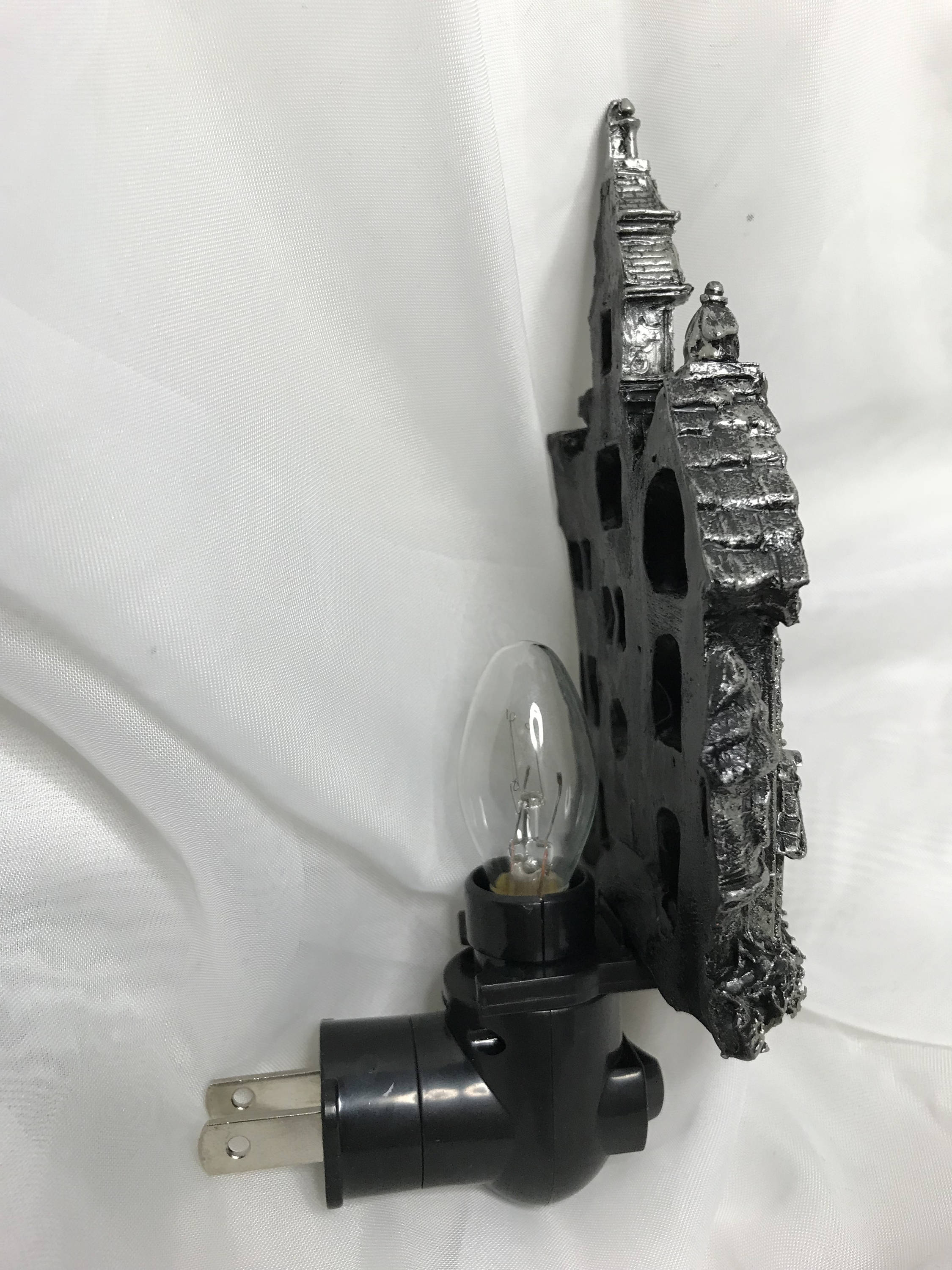 Light fixture with gear design on a white background